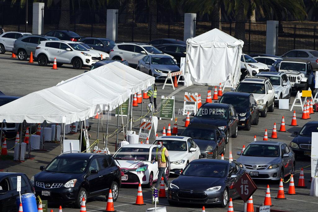 Marcio Jose Sanchez Motorists line up to take a COVID-19 test Tuesday, Jan. 5, 2021, in Los Angeles. (AP Photo/Marcio Jose Sanchez)