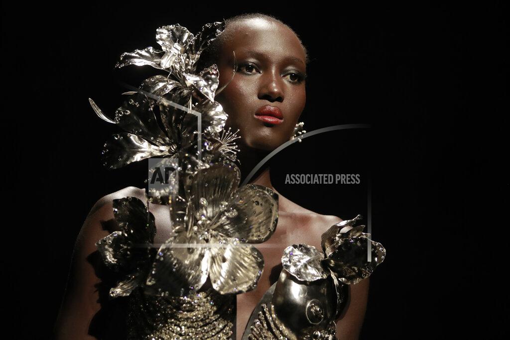 Lewis Joly A model wears a creation for Schiaparelli's Haute Couture Fall/Winter 2022-2023 fashion collection, Monday, July 4, 2022 in Paris. (AP Photo/Lewis Joly)