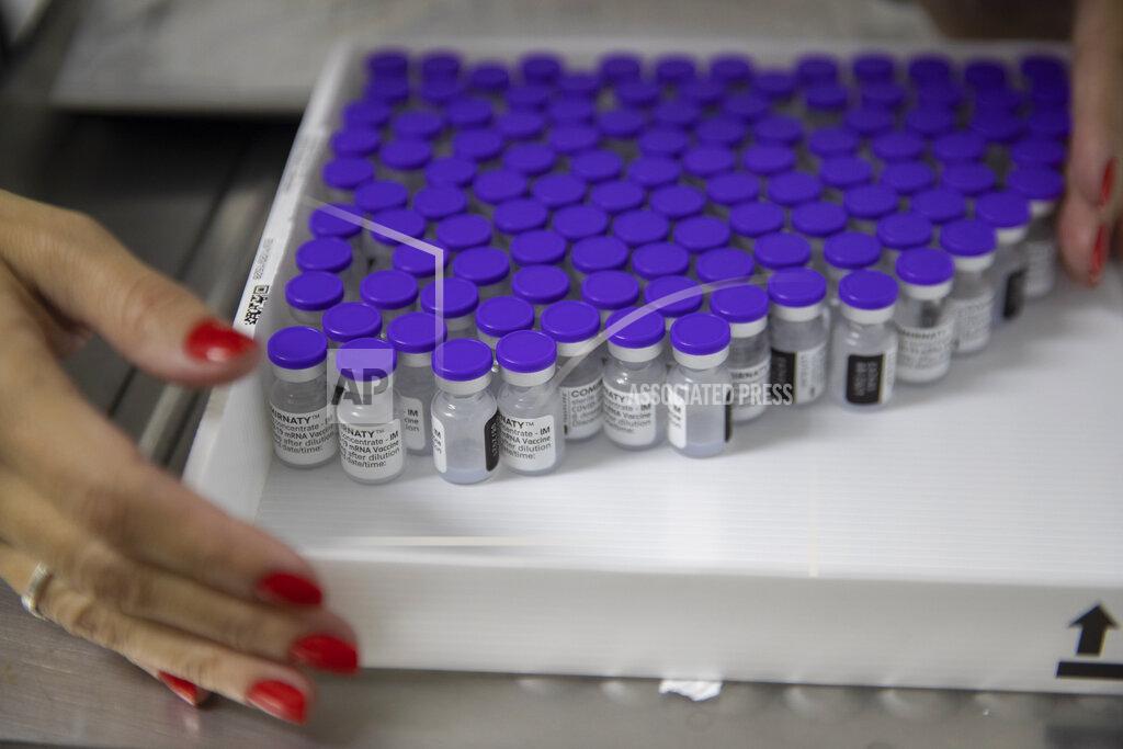 Andre Penner A health worker holds a tray with vials of the Pfizer vaccine for COVID-19 during a priority COVID-19 vaccination program at a community medical center in Sao Paulo, Brazil, Thursday, May 6, 2021. (AP Photo/Andre Penner)
