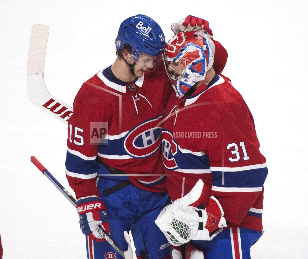 Graham Hughes Montreal Canadiens' Jesperi Kotkaniemi (15) celebrates with Carey Price after scoring against the Toronto Maple Leafs during overtime in Game 6 of an NHL hockey Stanley Cup first-round playoff seres Saturday, May 29, 2021, in Montreal. (Graham Hughes/The Canadian Press via AP)