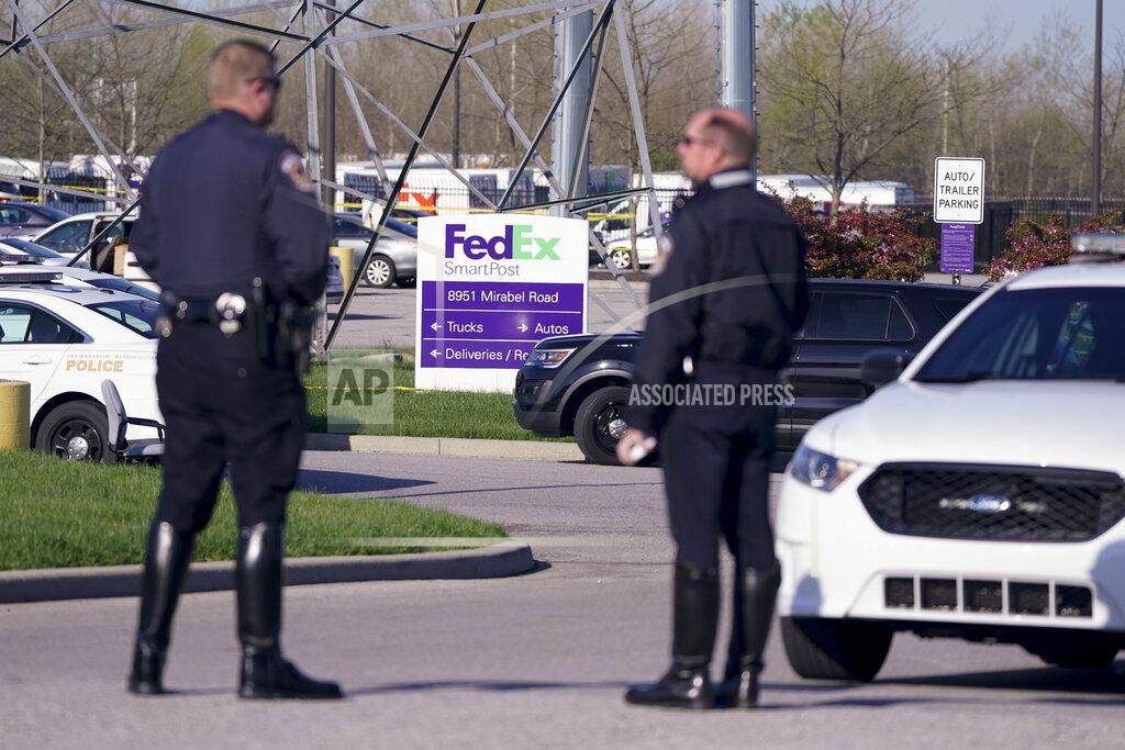 Michael Conroy Police stand near the scene where multiple people were shot at the FedEx Ground facility early Friday morning, April 16, 2021, in Indianapolis. A gunman killed eight people and wounded several others before apparently taking his own life in a late-night attack at a FedEx facility near the Indianapolis airport, police said, in the latest in a spate of mass shootings in the United States after a relative lull during the pandemic. (AP Photo/Michael Conroy)