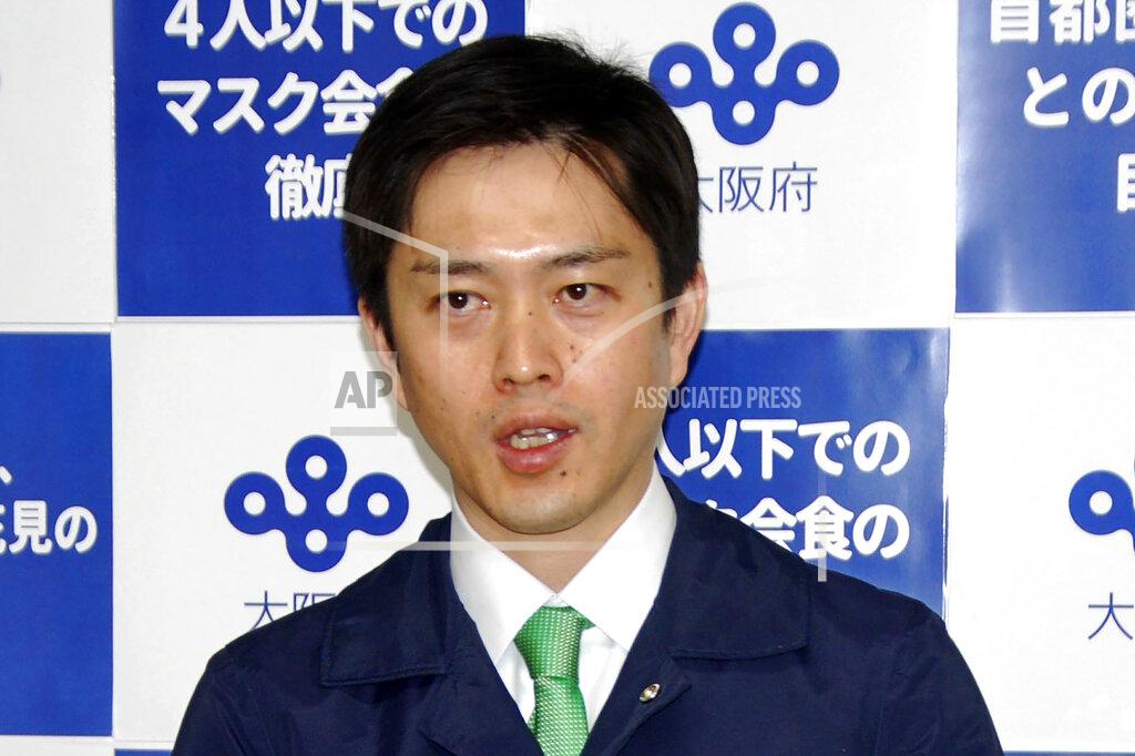 Osaka Gov. Hirofumi Yoshimura speaks to reporters in Osaka, western Japan Thursday, April 1, 2021. Yoshimura said on Thursday that he wants to cancel the Olympic torch relay legs going through Osaka later this month. (Kyodo News via AP)