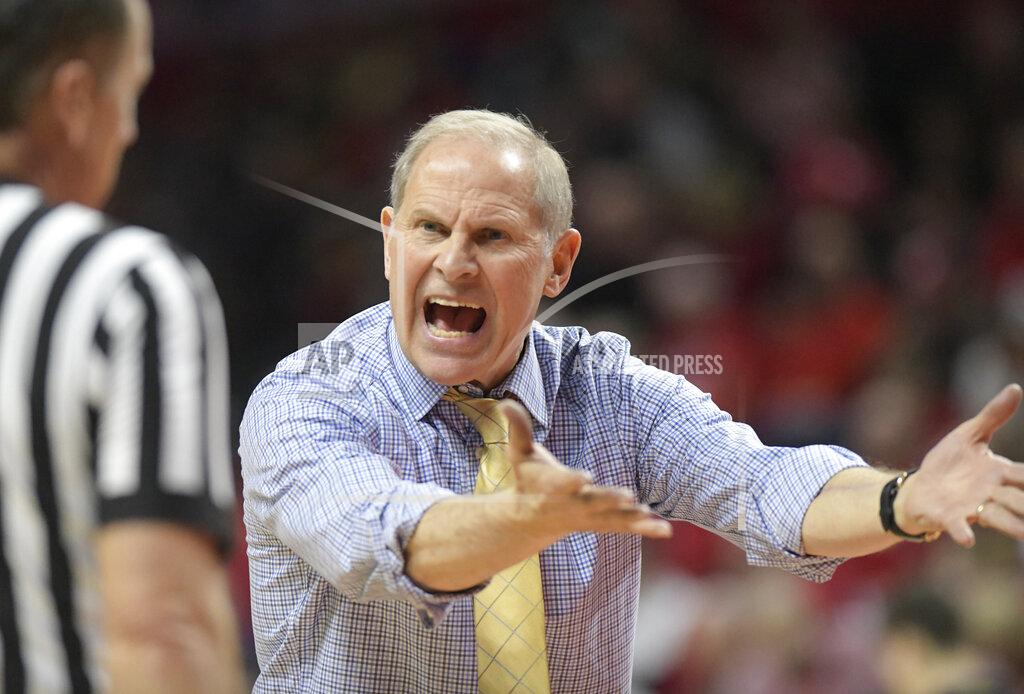 Bill Kostroun Michigan coach John Beilein talks to the referee during the second half of an NCAA college basketball game against the Rutgers Tuesday, Feb. 5, 2019, in Piscataway, N.J. Michigan won 77-65. (AP Photo/Bill Kostroun)