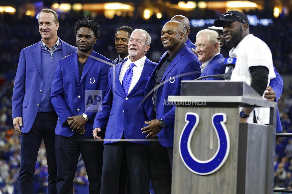 Darron Cummings Former Indianapolis Colts defensive end Dwight Freeney, center right, and Colts owner Jim Irsay, center left, pose with other members of the teams' Ring of Honor, including Peyton Manning, left, and Edgerrin James, during Freeney's induction ceremony at half time of an NFL football game against the Miami Dolphins in Indianapolis, Sunday, Nov. 10, 2019. (AP Photo/Darron Cummings)