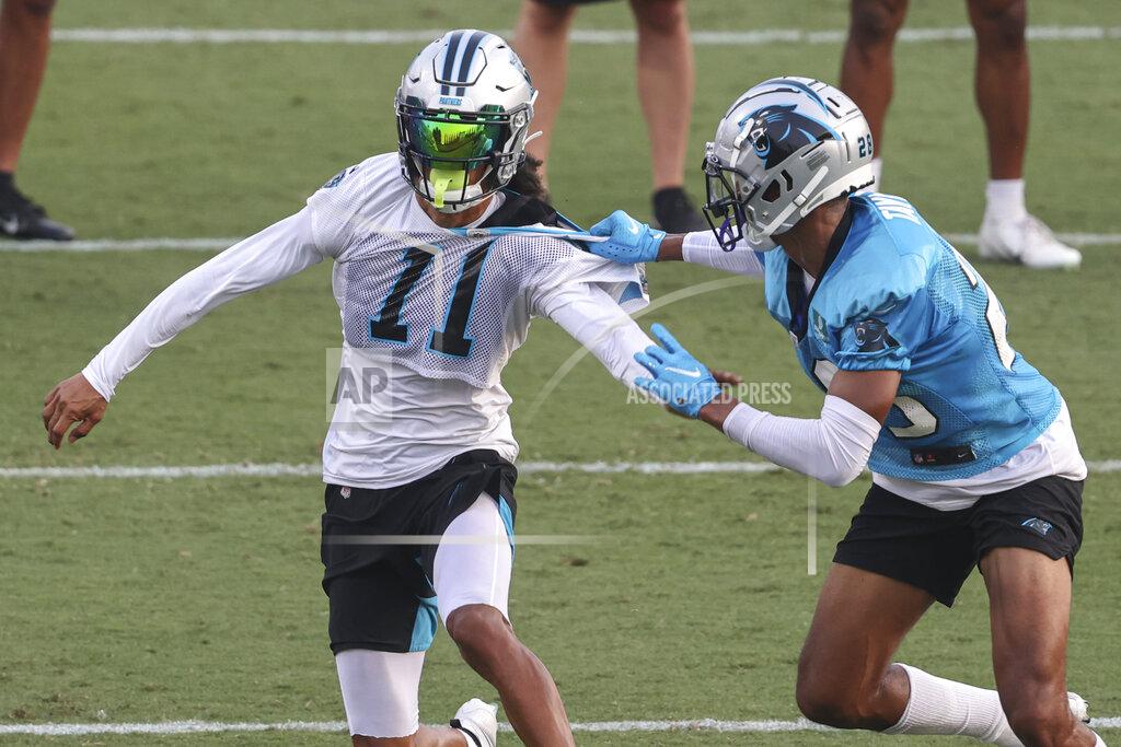 Carolina Panthers wide receiver Robby Anderson, left, and linebacker Jeremy Chinn battle for position during practice at Back Together Saturday at the NFL football team's training camp in Spartanburg, S.C., Saturday, July 31, 2021. (AP Photo/Nell Redmond)
