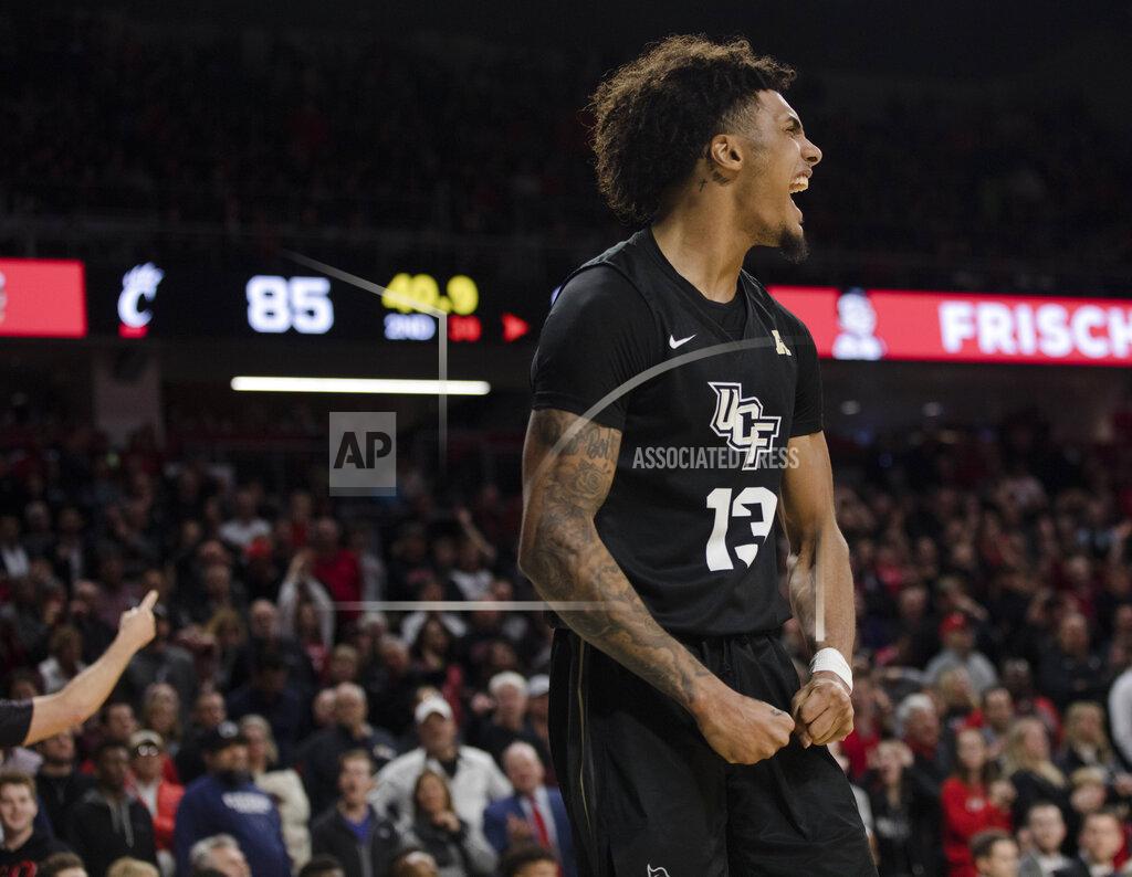 Albert Cesare Central Florida guard Brandon Mahan (13) during the second overtime of the team's NCAA college basketball game against Cincinnati on Wednesday, Feb. 19, 2020, in Cincinnati. (Albert Cesare/The Cincinnati Enquirer via AP)