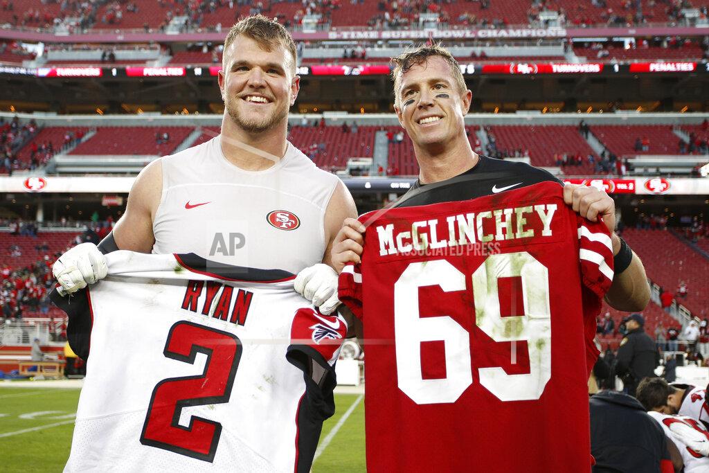 Josie Lepe San Francisco 49ers offensive tackle Mike McGlinchey, left, poses for photos while exchanging jerseys with Atlanta Falcons quarterback Matt Ryan after an NFL football game in Santa Clara, Calif., Sunday, Dec. 15, 2019. (AP Photo/Josie Lepe)