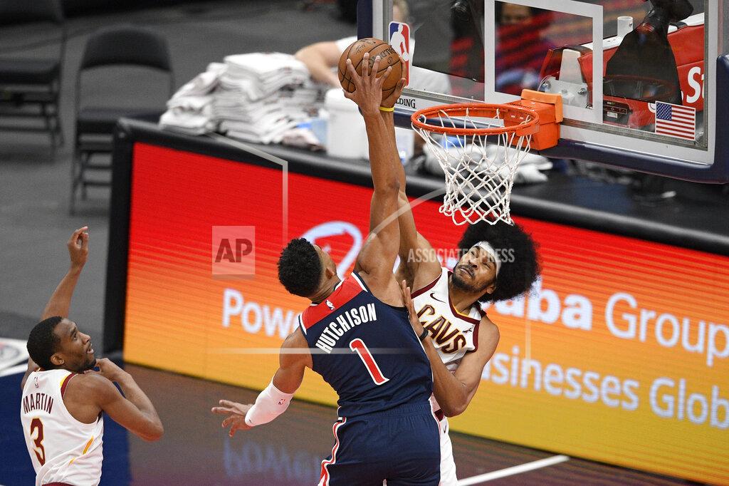 Nick Wass Cleveland Cavaliers center Jarrett Allen, back, blocks a shot by Washington Wizards forward Chandler Hutchison (1) during the second half of an NBA basketball game Friday, May 14, 2021, in Washington. Cavaliers guard Jeremiah Martin is at left. (AP Photo/Nick Wass)