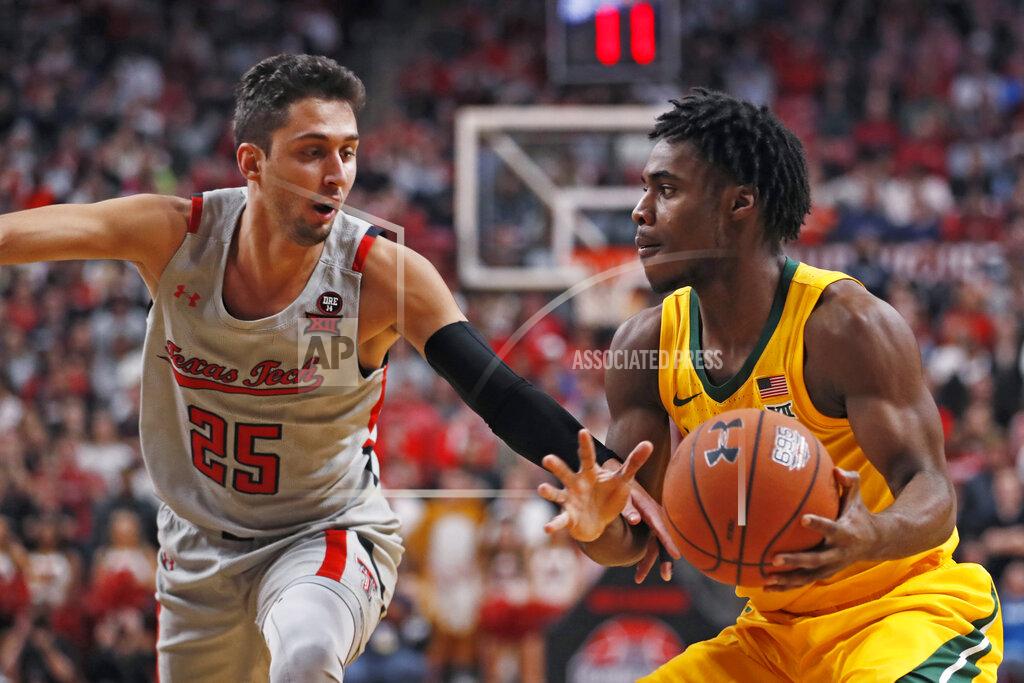 Brad Tollefson Texas Tech's Davide Moretti (25) tries to steal the ball from Baylor's Davion Mitchell during the first half of an NCAA college basketball game Tuesday, Jan. 7, 2020, in Lubbock, Texas. (AP Photo/Brad Tollefson)