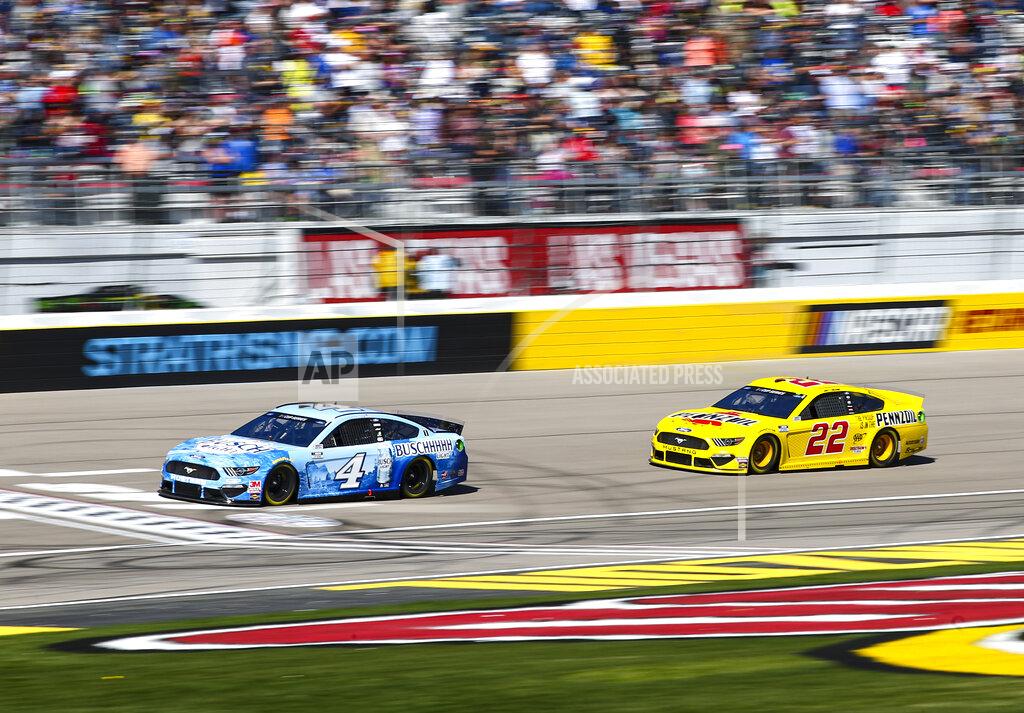 Chase Stevens Kevin Harvick (4) and Joey Logano (22) drive during a NASCAR Cup Series auto race at the Las Vegas Motor Speedway on Sunday, Feb. 23, 2020. (AP Photo/Chase Stevens)
