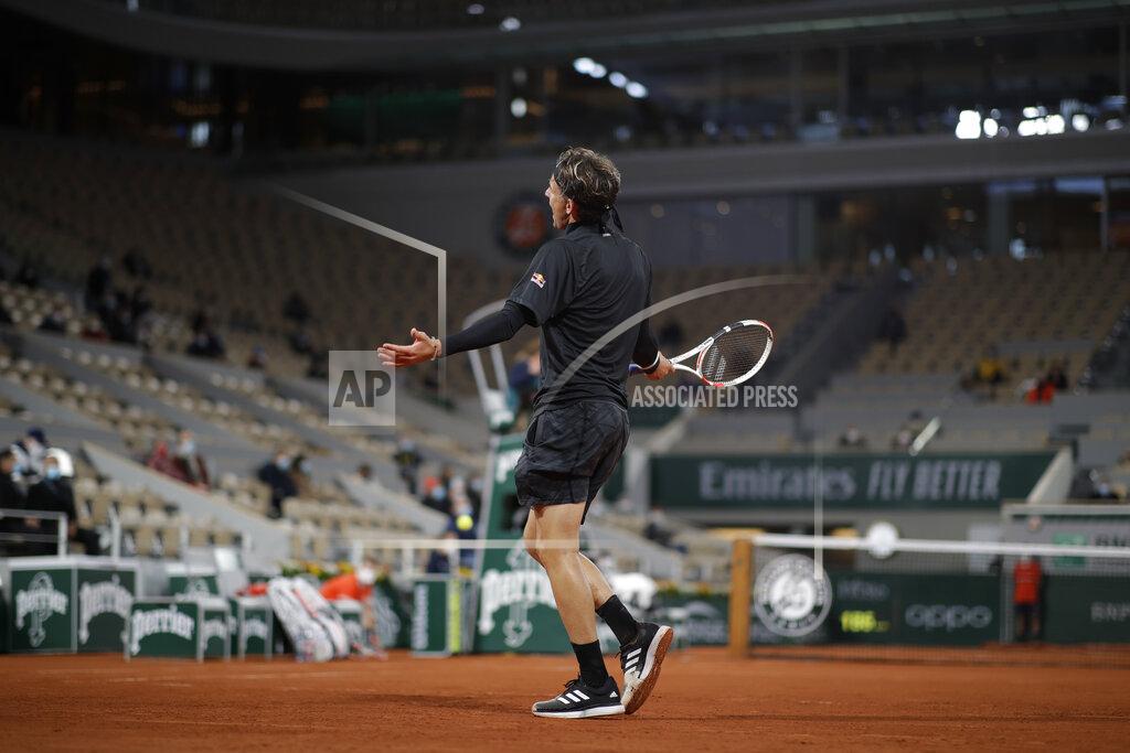 Alessandra Tarantino Austria's Dominic Thiem reacts in the first round match of the French Open tennis tournament against Croatia's Marin Cilic at the Roland Garros stadium in Paris, France, Monday, Sept. 28, 2020. (AP Photo/Alessandra Tarantino)