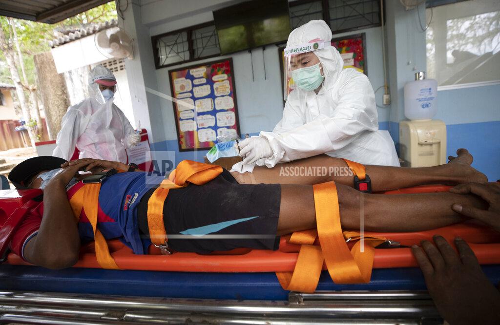 Sakchai Lalit Medical workers attend to an injured Karen villager from Myanmar who crossed Salawin river on a boat, at Ban Mae Sam Laep Health Center, Mae Hong Son province, northern Thailand on Tuesday March 30, 2021. The weekend strikes by the Myanmar military, which sent ethnic Karen people seeking safety in Thailand, represented another escalation in the violent crackdown by Myanmar’s junta on protests of its Feb. 1 takeover.(AP Photo/Sakchai Lalit)