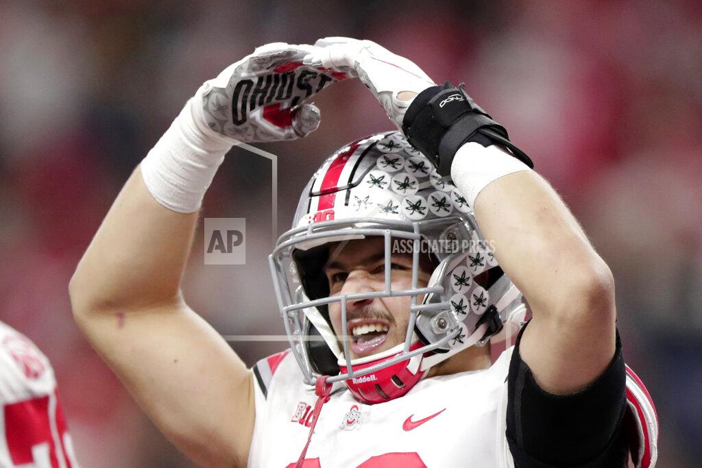 Michael Conroy Ohio State tight end Jeremy Ruckert celebrates after scoring a touchdown during the second half of the Big Ten championship NCAA college football game against Wisconsin, Saturday, Dec. 7, 2019, in Indianapolis. (AP Photo/Michael Conroy)