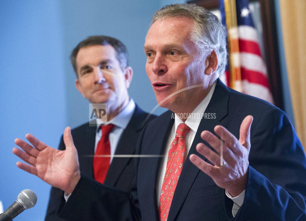 Steve Helber FILE - In this Jan. 9, 2018, file photo, former Virginia Gov. Terry McAuliffe, right, speaks to the media along with Gov. Ralph Northam at the Capitol in Richmond, Va. Northam announced Thursday, April 8, 2021, that he was backing McAuliffe in the race to succeed him, handing his predecessor one of the contest's most coveted endorsements. (AP Photo/Steve Helber, File)