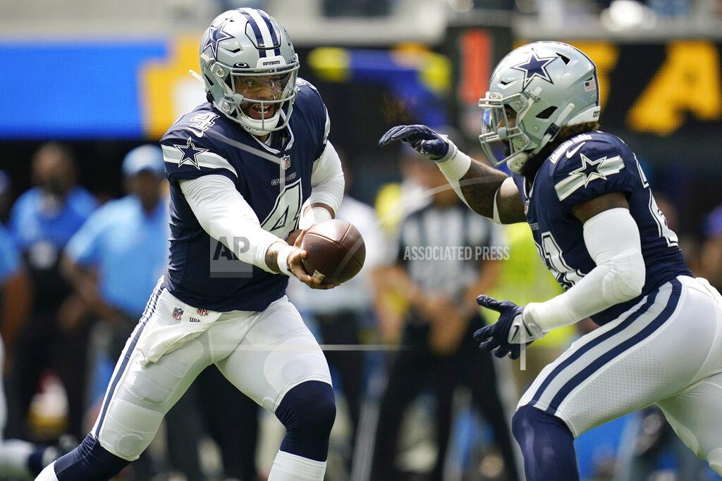 Ashley Landis FILE - In this Sunday, Sept. 19, 2021, file photo, Dallas Cowboys quarterback Dak Prescott (4) hands off to running back Ezekiel Elliott during the first half of an NFL football game in Inglewood, Calif. So much has changed in the two years since the Cowboys and New England Patriots last met In their 2019 matchup of New England’s top-ranked defense and Dallas’ top-ranked offense. (AP Photo/Ashley Landis, File)