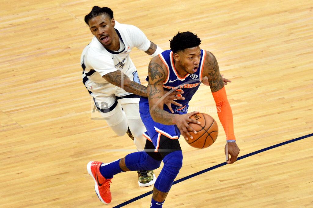 Brandon Dill New York Knicks guard Elfrid Payton handles the ball against Memphis Grizzlies guard Ja Morant in the second half of an NBA basketball game Monday, May 3, 2021, in Memphis, Tenn. (AP Photo/Brandon Dill)