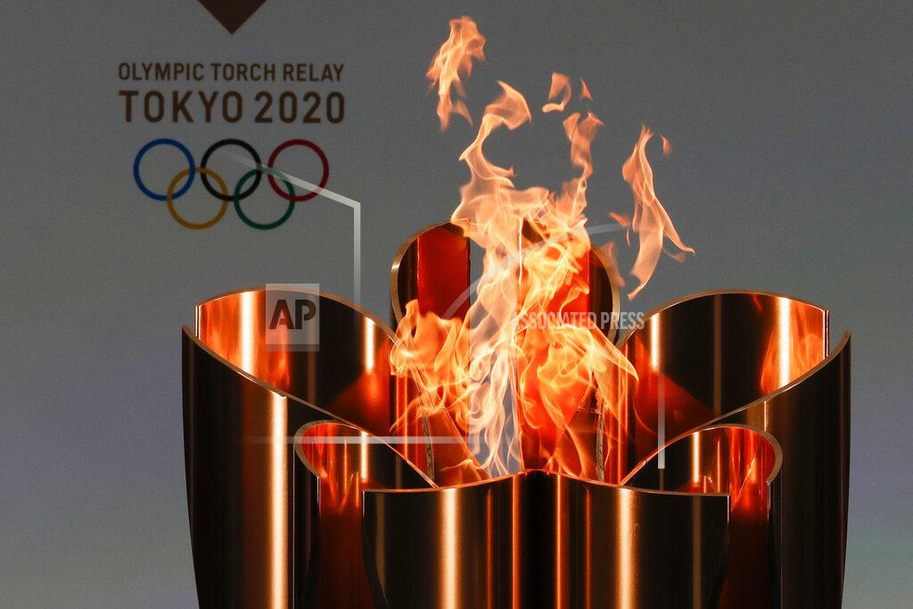 Kim Kyung-Hoon The celebration cauldron is seen lit on the first day of the Tokyo 2020 Olympic torch relay in Naraha, Fukushima prefecture, northeastern Japan, Thursday, March 25, 2021. The torch relay for the postponed Tokyo Olympics began its 121-day journey across Japan on Thursday and is headed toward the opening ceremony in Tokyo on July 23. (Kim Kyung-Hoon/Pool Photo via AP)