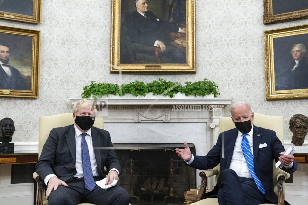 Alex Brandon President Joe Biden, right, speaks during a meeting with British Prime Minister Boris Johnson in the Oval Office of the White House, Tuesday, Sept. 21, 2021, in Washington. (AP Photo/Alex Brandon)