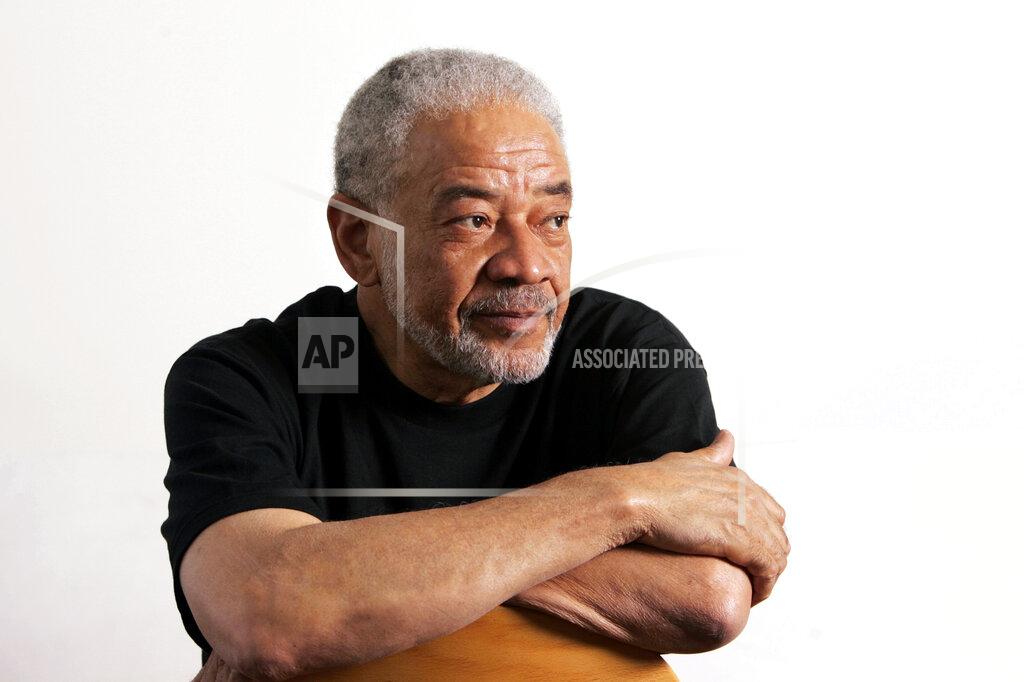 Reed Saxon FILE - In this June 21, 2006 file photo, singer-songwriter Bill Withers poses in his office in Beverly Hills, Calif. Withers, who wrote and sang a string of soulful songs in the 1970s that have stood the test of time, including “Lean On Me,” “Lovely Day” and “Ain’t No Sunshine," died in Los Angeles from heart complications on Monday, March 30, 2020. He was 81. (AP Photo/Reed Saxon, File)