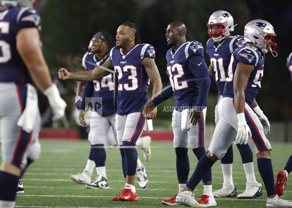 Elise Amendola New England Patriots' Patrick Chung (23) Devin McCourty (32), and Deatrich Wise (91), encourage teammates after a series of plays in the first half of an NFL preseason football game against the New York Giants, Thursday, Aug. 29, 2019, in Foxborough, Mass. (AP Photo/Elise Amendola)
