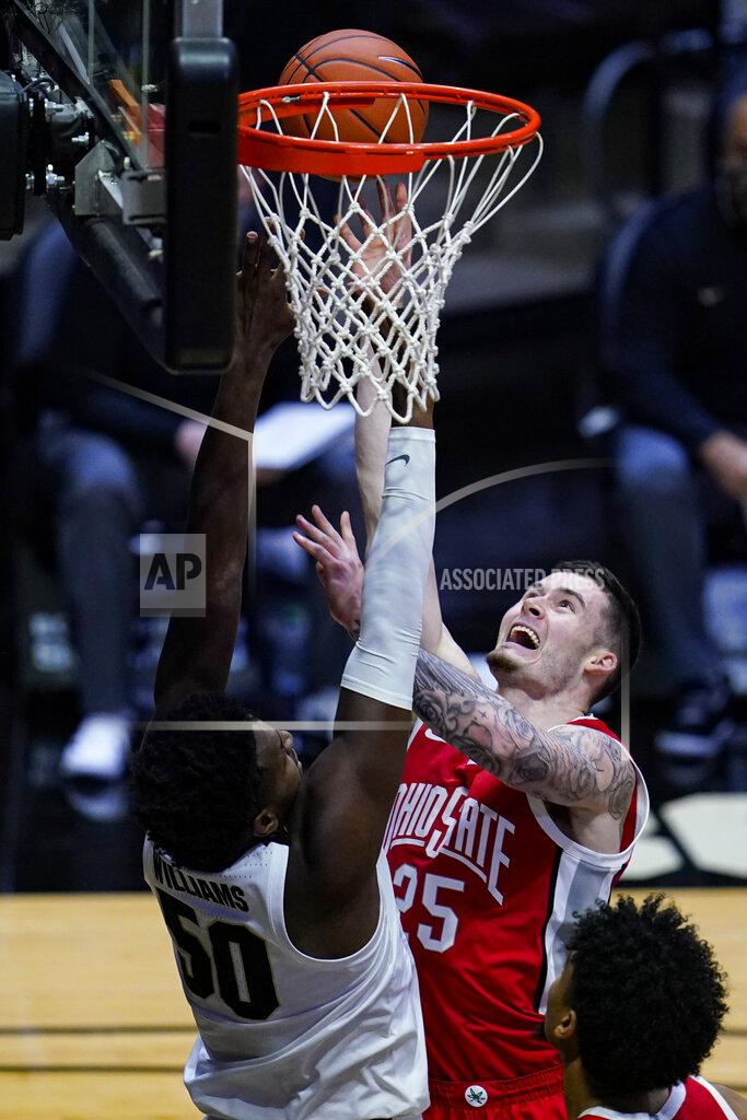 Michael Conroy Ohio State forward Kyle Young (25) shoots over Purdue forward Trevion Williams (50) during the first half of an NCAA college basketball game in West Lafayette, Ind., Wednesday, Dec. 16, 2020. (AP Photo/Michael Conroy)