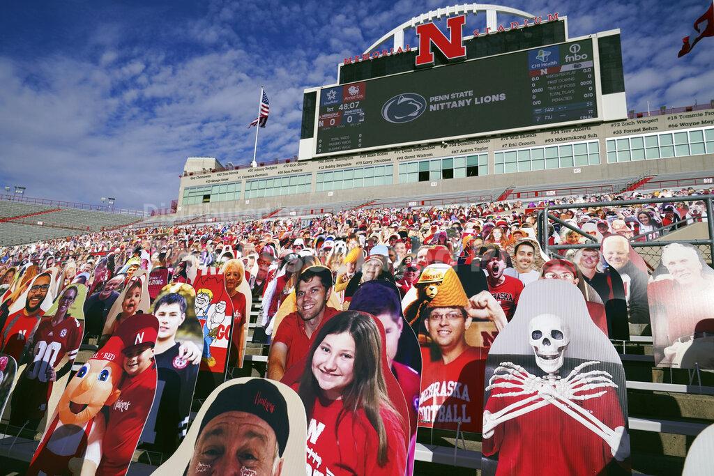 Cutouts of fans and other entities are attached to benches to fill up the empty stands in the time of COVID-19, before an NCAA college football game between Penn State and Nebraska, in Lincoln, Neb., Saturday, Nov. 14, 2020. (AP Photo/Nati Harnik)