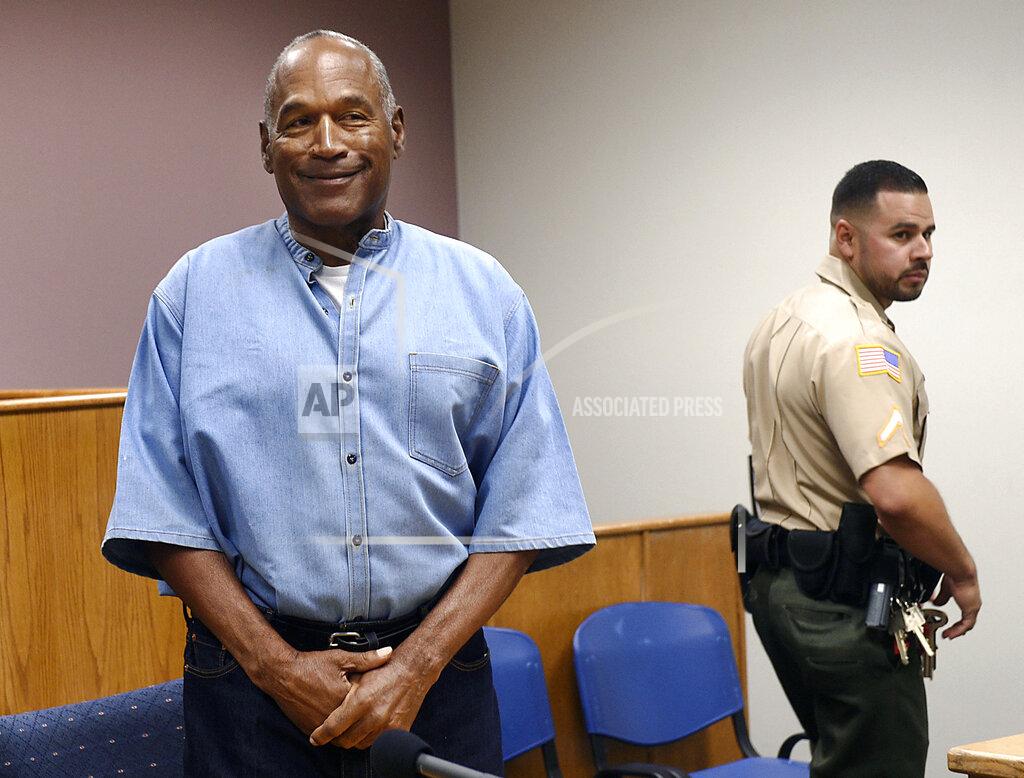Jason Bean FILE - In this July 20, 2017, file photo, former NFL football star O.J. Simpson enters his parole hearing at the Lovelock Correctional Center in Lovelock, Nev. Simpson is suing a Las Vegas hotel-casino, alleging unnamed employees defamed him by telling celebrity news site TMZ he was ordered off the property in 2017 for being drunk, disruptive and unruly.
(Jason Bean/The Reno Gazette-Journal via AP, Pool, File)