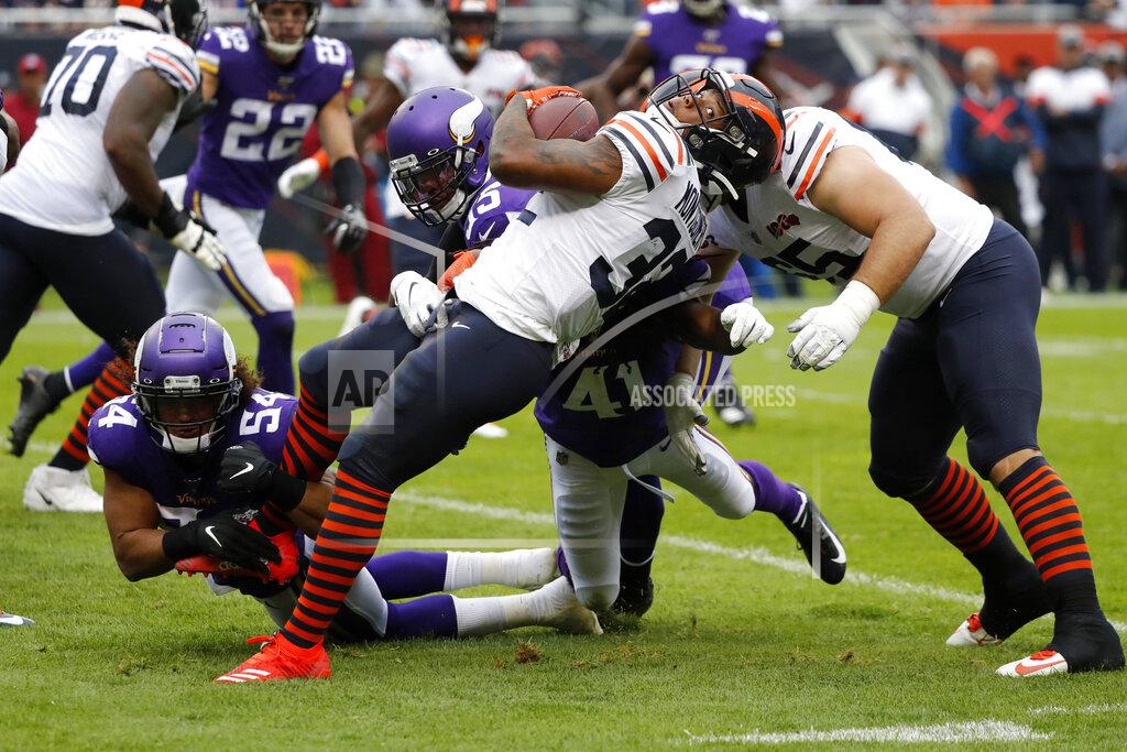 Charles Rex Arbogast Chicago Bears running back David Montgomery (32) runs with the ball as Minnesota Vikings middle linebacker Eric Kendricks (54) defends during the half of an NFL football game Sunday, Sept. 29, 2019, in Chicago. (AP Photo/Charles Rex Arbogast)