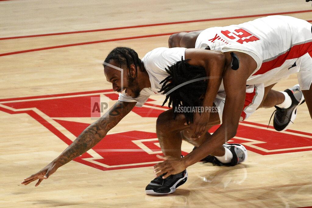 Eric Christian Smith Houston guard Tramon Mark, right, celebrates his game-winning 3-point basket with DeJon Jarreau during the second half of an NCAA college basketball game against Memphis, Sunday, March 7, 2021, in Houston. (AP Photo/Eric Christian Smith)