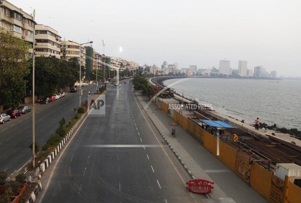 Rajanish Kakade FILE - In this April 15, 2021, file photo, marine line wears a deserted look following restrictions in Mumbai, India. The picture is still grim in parts of Europe and Asia as variants of the virus fuel an increase in new cases and the worldwide death toll closes in on 3 million. (AP Photo/Rajanish Kakade, File)