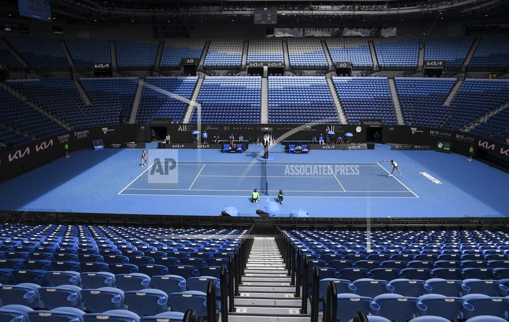 Andy Brownbill Karolina Muchova of the Czech Republic and compatriot Karolina Pliskova play in an empty Rod Laver Arena during their third round match at the Australian Open tennis championship in Melbourne, Australia, Saturday, Feb. 13, 2021. The Australian Open continues but without crowds after the Victoria state government imposed a five-day lockdown starting Saturday in response to a COVID-19 outbreak at a quarantine hotel.(AP Photo/Andy Brownbill)