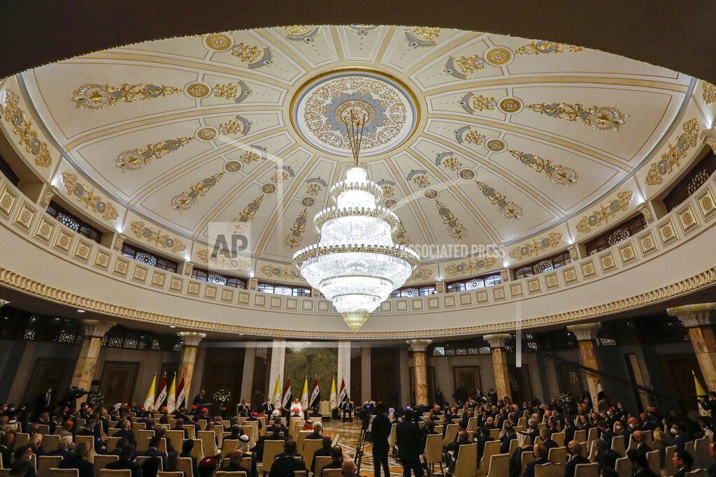 Andrew Medichini Pope Francis meets authorities and civil society at Baghdad's Presidential Palace, Iraq, Friday, March 5, 2021. Pope Francis has arrived in Iraq to urge the country's dwindling number of Christians to stay put and help rebuild the country after years of war and persecution, brushing aside the coronavirus pandemic and security concerns. (AP Photo/Andrew Medichini)