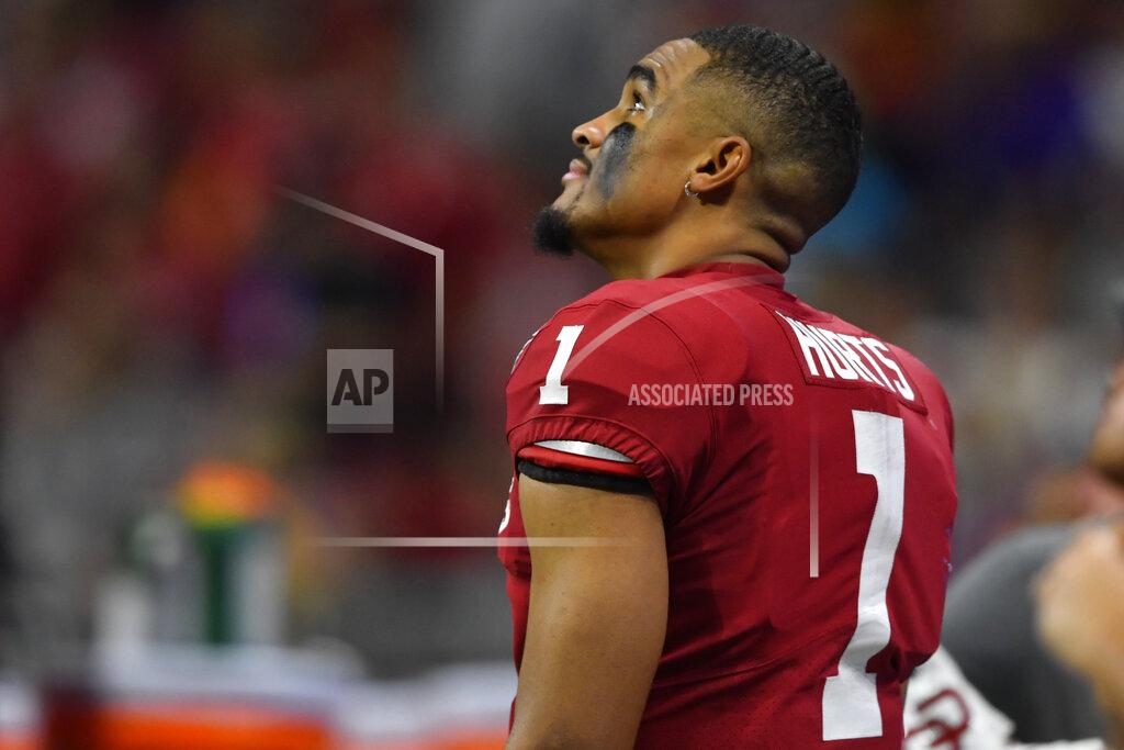 John Amis Oklahoma quarterback Jalen Hurts (1) watches a replay against LSU during the second half of the Peach Bowl NCAA semifinal college football playoff game, Saturday, Dec. 28, 2019, in Atlanta. (AP Photo/John Amis)