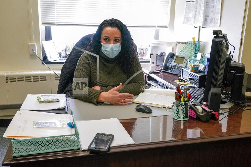 Mary Altaffer School Counseling Carli Rocha-Reaes gestures as she speaks during an interview, Thursday, Feb. 25, 2021, in Bridgeport. Conn. School counselors in many urban, high needs districts have been consumed with efforts to help students engage with their schoolwork since the pandemic hit. (AP Photo/Mary Altaffer)