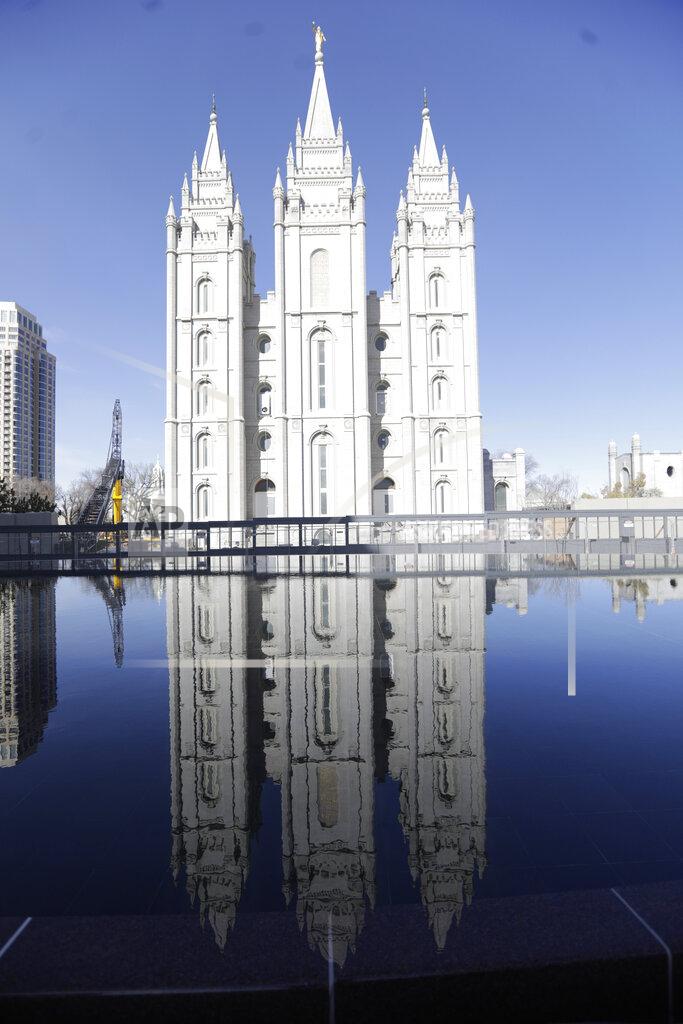 The Salt Lake Temple at Temple Square is shown during The Church of Jesus Christ of Latter-day Saints' twice-annual church conference Saturday, April 4, 2020, in Salt Lake City. The twice-annual conference kicked off Saturday without anyone attending in person and top leaders sitting some 6 feet apart inside an empty room as the faith takes precautions to avoid the spread of the coronavirus. A livestream of the conference showed a few of the faith's top leaders sitting alone inside a small auditorium in Salt Lake City, Normally, top leaders sit side-by-side on stage with the religion's well-known choir behind them and some 20,000 people watching. (AP Photo/Rick Bowmer)
