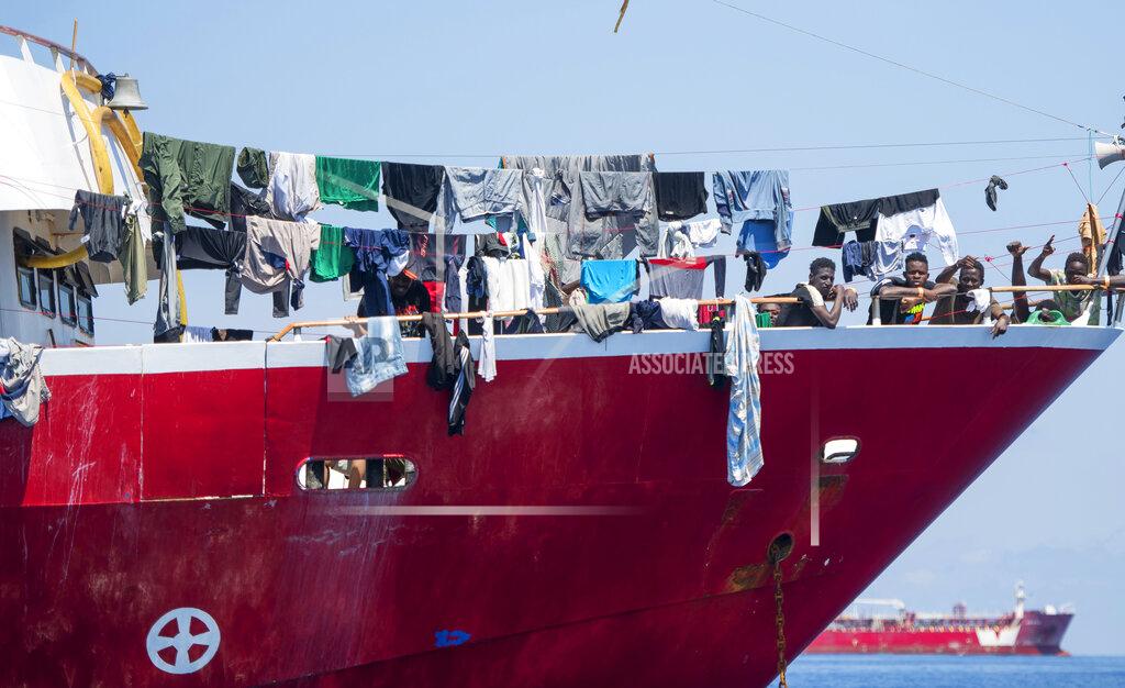 Rene' Rossignaud In this photo taken Tuesday, June 2, 2020, migrants dry their clothes aboard a tourist boats some 20 kilometers from Malta, . More than 400 migrants are living aboard pleasure cruise vessels, bobbing in the sea off Malta, many of them for weeks now. Rescued from human traffickers’ unseaworthy boats in several operations in the central Mediterranean since late April, the migrants, along with the Maltese government, are waiting for European Union countries to offer to take them. (AP Photo/Rene' Rossignaud)