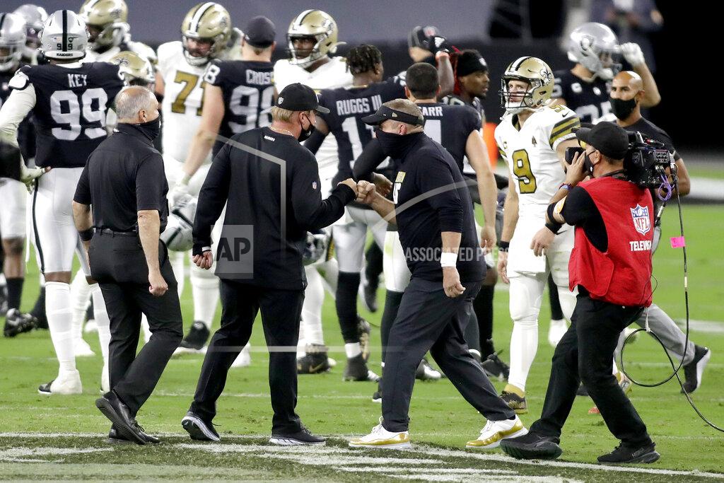 Isaac Brekken Las Vegas Raiders head coach Jon Gruden, left, bumps fists with New Orleans Saints head coach Sean Payton after an NFL football game, Monday, Sept. 21, 2020, in Las Vegas. (AP Photo/Isaac Brekken)