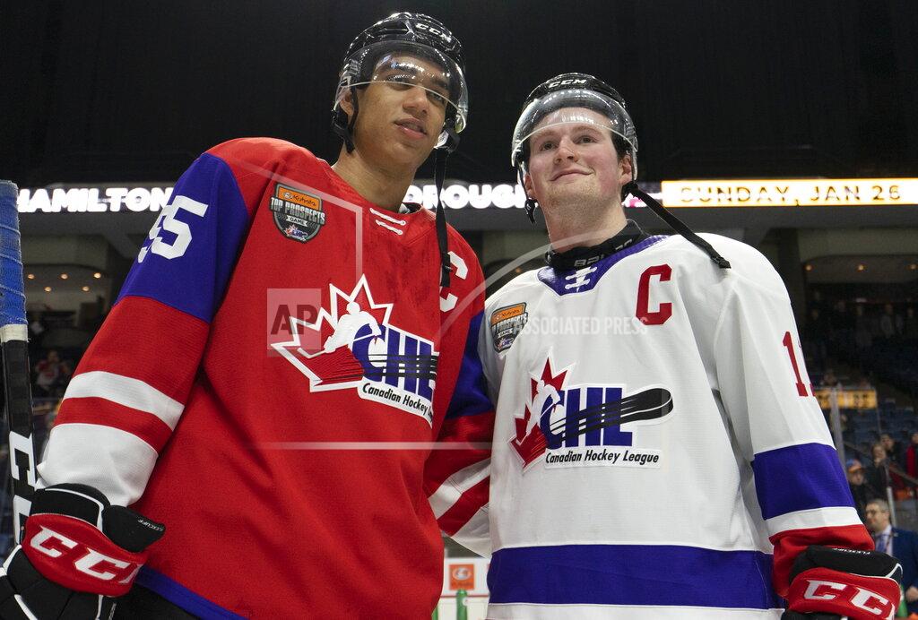 Peter Power FILE - In this Jan. 16, 2020, file photo, Team Red center Quinton Byfield (55) and Team White left winger Alexis Lafreniere (11) pose for photos following hockey's CHL Top Prospects Game in Hamilton, Ontario. The New York Rangers might be on the clock in owning the No. 1 pick in the NHL draft on Tuesday, Oct. 6. That, and the prospect of selecting Quebec star forward Alexis Lafreniere, doesn't mean the still-retooling Rangers will be anywhere closer to being a contender, team president John Davidson cautions. (Peter Power/The Canadian Press via AP)