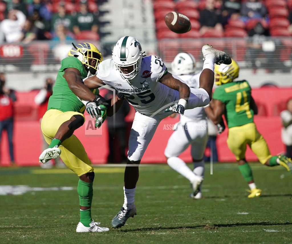 Tony Avelar Oregon Ducks safety Ugochukwu Amadi (7) breaks up a pass for Michigan State Spartans wide receiver Darrell Stewart Jr. (25) during the first half of the Redbox Bowl NCAA college football game Monday, Dec. 31, 2018, in Santa Clara, Calif. (AP Photo/Tony Avelar)