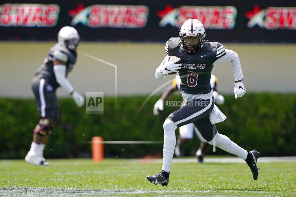 Rogelio V. Solis Alabama A&M wide receiver Zabrian Moore (8) takes a pass reception upfield against Arkansas-Pine Bluff during the first half of the Southwestern Athletic Conference NCAA college football game, Saturday, May 1, 2021, in Jackson, Miss. (AP Photo/Rogelio V. Solis)