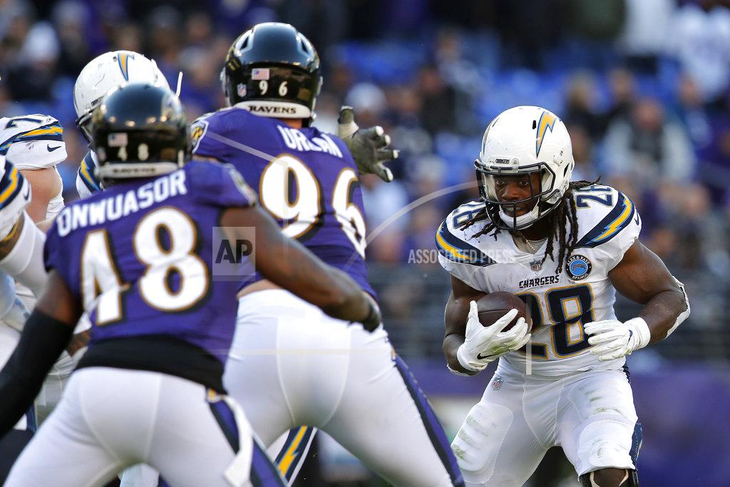 Carolyn Kaster Los Angeles Chargers running back Melvin Gordon (28) rushes the ball in the second half of an NFL wild card playoff football game against the Baltimore Ravens, Sunday, Jan. 6, 2019, in Baltimore. (AP Photo/Carolyn Kaster)