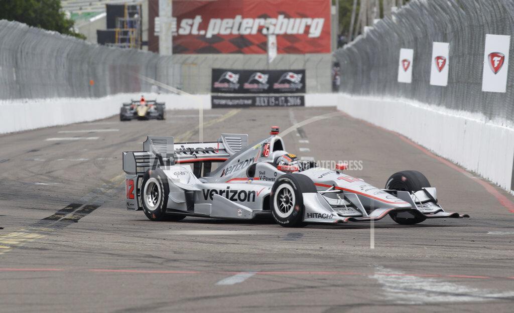 FILE - In this March 13, 2016, file photo, Oriol Servia, of Spain, drives the car of Will Power, of Australia, into Turn 10 during the IndyCar Firestone Grand Prix of St. Petersburg auto race in St. Petersburg, Fla. IndyCar plans to crown its champion on the streets of St. Petersburg, Florida, as the original opener has been rescheduled to Oct. 25 as the finale. (AP Photo/Luis M. Alvarez, File)