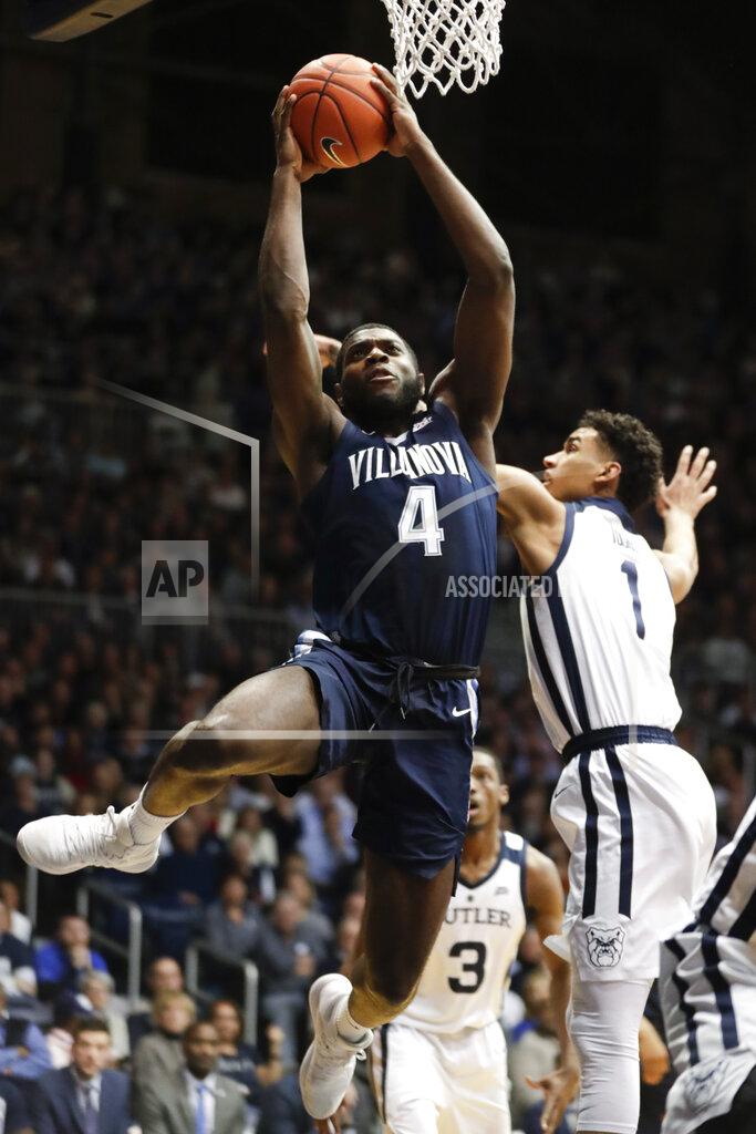 Michael Conroy Villanova forward Eric Paschall (4) shoots in front of Butler forward Jordan Tucker (1) in the first half of an NCAA college basketball game in Indianapolis, Tuesday, Jan. 22, 2019. (AP Photo/Michael Conroy)