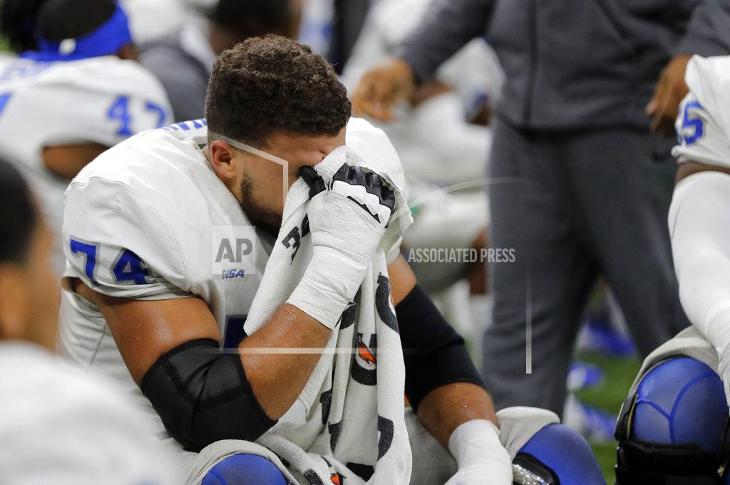 Gerald Herbert Middle Tennessee offensive lineman Robert Behanan (74) reacts on the bench in the second half of the New Orleans Bowl NCAA college football game against Appalachian State in New Orleans, Saturday, Dec. 15, 2018. Appalachian State won 45-13. (AP Photo/Gerald Herbert)