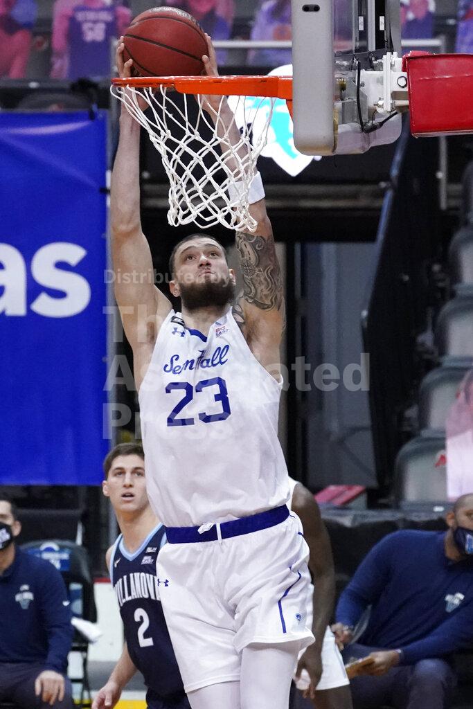 Seton Hall forward Sandro Mamukelashvili dunks during the first half of an NCAA college basketball game against Villanova, Saturday, Jan. 30, 2021, in Newark, N.J. (AP Photo/Mary Altaffer)