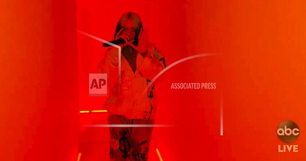 Uncredited In this screen shot provided by ABC on Sunday, Nov. 22, 2020, Billie Eilish performs "Therefore I Am" at the American Music Awards at the Microsoft Theater in Los Angeles. (ABC via AP)