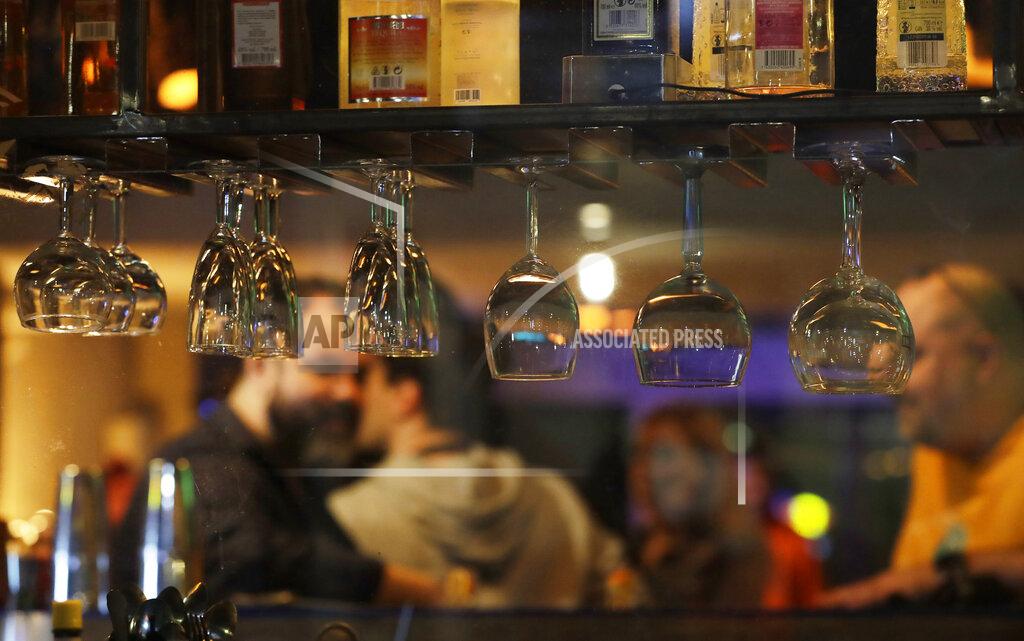 Czarek Sokolowski People gather and celebrate as bars, clubs and other establishments reopened in Poland after being closed for seven months, in Warsaw, Poland, Friday, May 14, 2021. (AP Photo/Czarek Sokolowski)