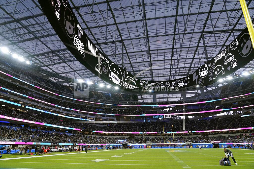Marcio Jose Sanchez Players leave the field at SoFi Stadium during a weather delay shortly before the scheduled start of an NFL football game between the Los Angeles Chargers and the Las Vegas Raiders, Monday, Oct. 4, 2021, in Inglewood, Calif. (AP Photo/Marcio Jose Sanchez)