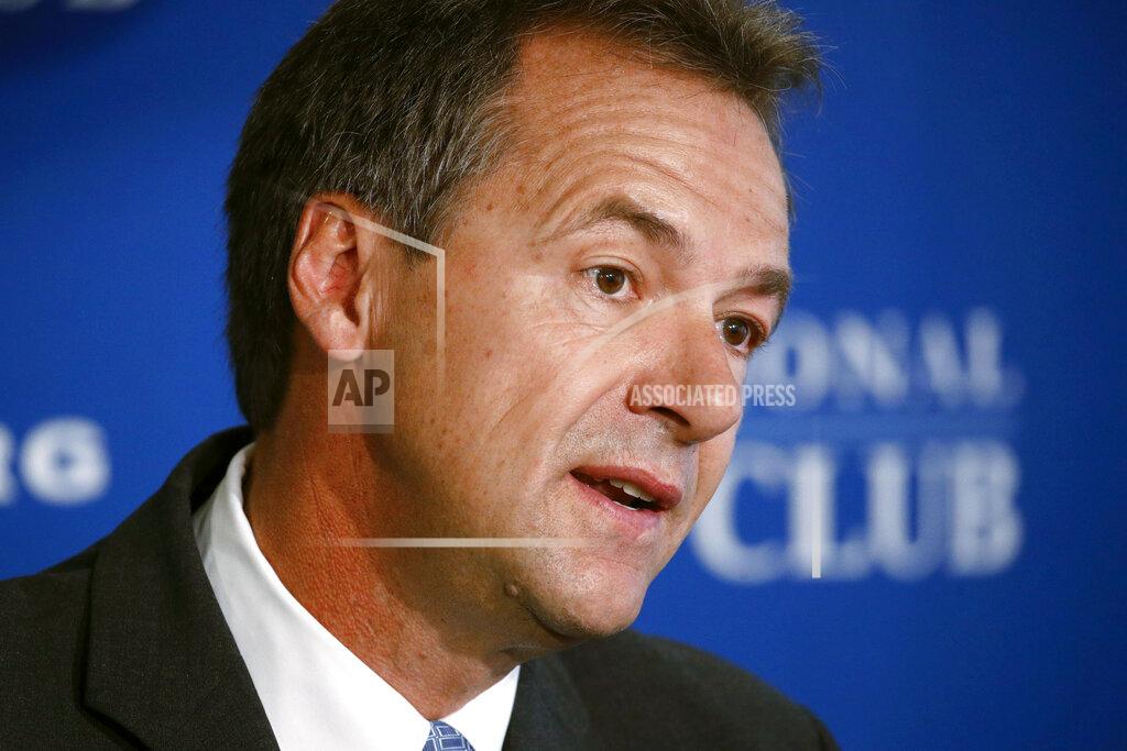 Patrick Semansky FILE - In this Aug. 7, 2019 file photo, Democratic Montana Gov. Steve Bullock speaks at the National Press Club in Washington. Bullock was the lame-duck governor of solidly red Montana, fresh off a failed Democratic presidential bid, when he pivoted and announced he’d challenge Republican Sen. Steve Daines for his seat. But days after he announced his candidacy last month, the coronavirus claimed its first cases in Montana. That shifted the spotlight onto Bullock as he leads the state’s pandemic response, leaving Daines in the unusual position of a sitting senator competing for attention. (AP Photo/Patrick Semansky, File)