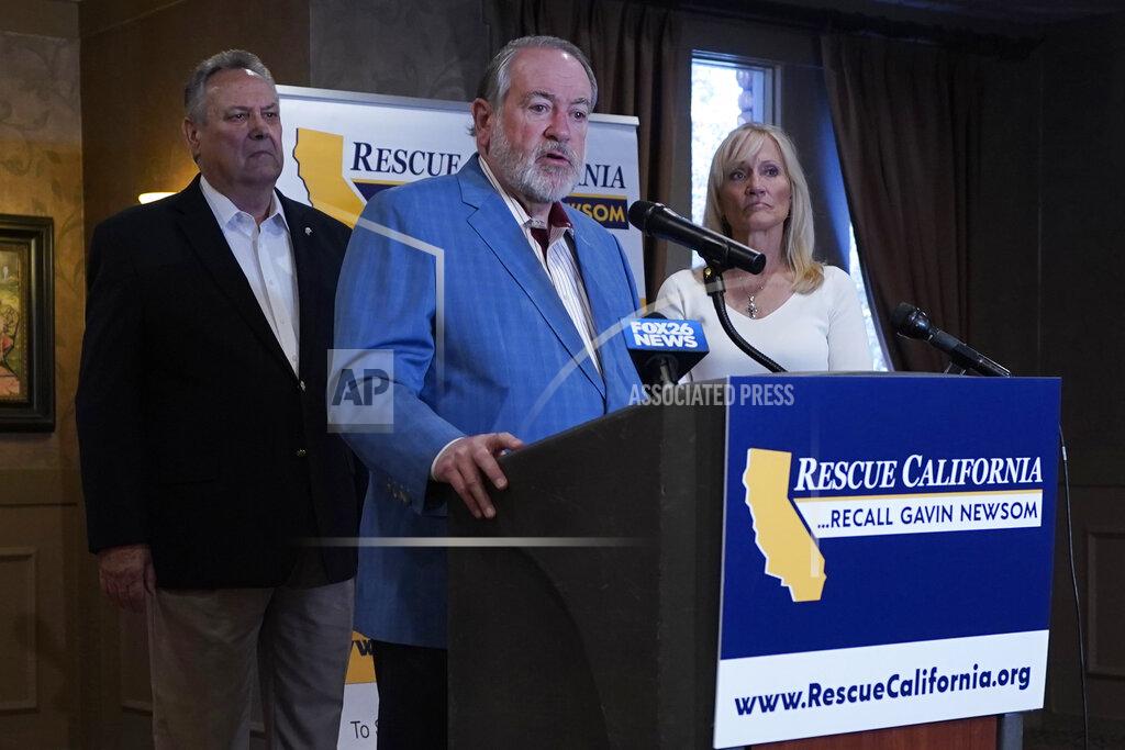 Rich Pedroncelli Former Arkansas Gov. Mike Huckabee, a Republican, speaks in support of the recall of Calif., Gov. Gavin Newsom Calif., Friday, July 30, 2021. Huckabee, flanked by former California Secretary of State Bill Jones, a Republican, and Anne Dunsmore, campaign manager of the pro-recall group Rescue California, attended a fund raising breakfast for the recall campaign. While Democratic registration almost doubles that of Republicans in the state, Democratic Party leaders fear Republicans appear more eager to vote in the Sept. 14 election. (AP Photo/Rich Pedroncelli))